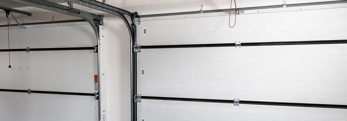 Fix Folding Garage Door Jerking in Bracebridge, Ontario