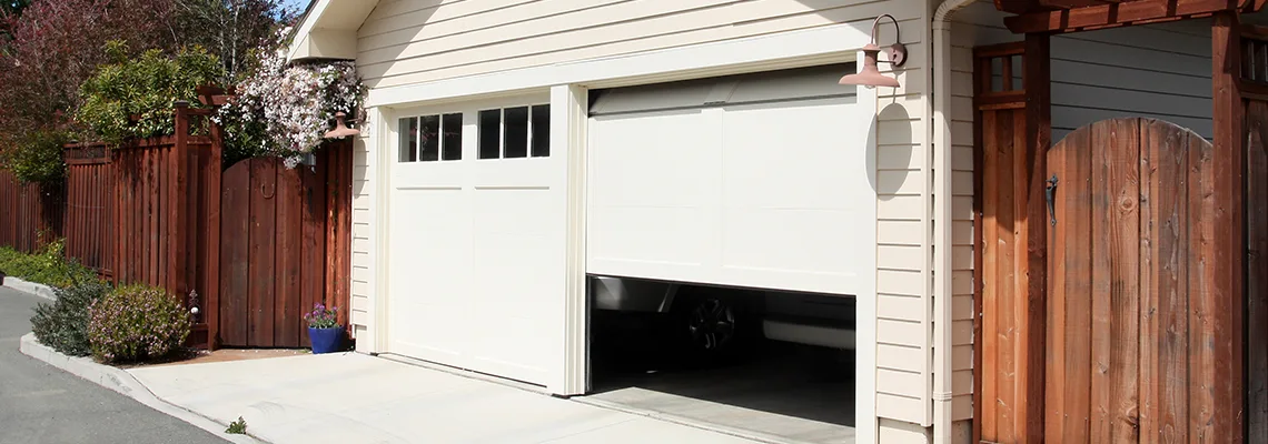 Fix Metal Garage Door Jerking in Bracebridge, Ontario
